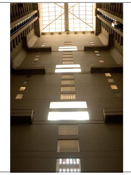 Looking up through the grand atrium of the Lower Parel twin towers. This view highlights the interplay of light and shadow on the concrete forms, heralding a new chapter in residential construction.