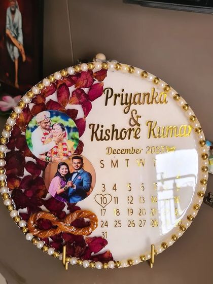 This custom resin calendar frame preserves both the thali thread and varmala flowers from a wedding. It's a beautiful way to display multiple precious memories from the ceremony.