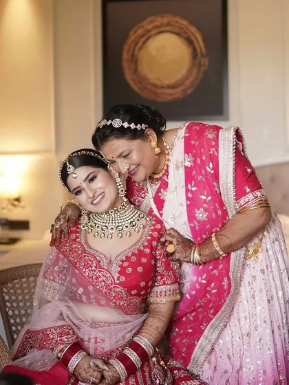 A heartwarming moment between the bride and her mother. Both ladies are glowing, showcasing our ability to create beautiful looks for every generation.