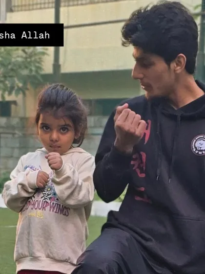 A close-up shot of me teaching a fighting stance to one of my youngest students.