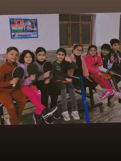 My academy is more than just a place to train; it's a community. This is part of the team, taking a moment to relax between drills. I foster a supportive and friendly environment where kids can build friendships and grow together.