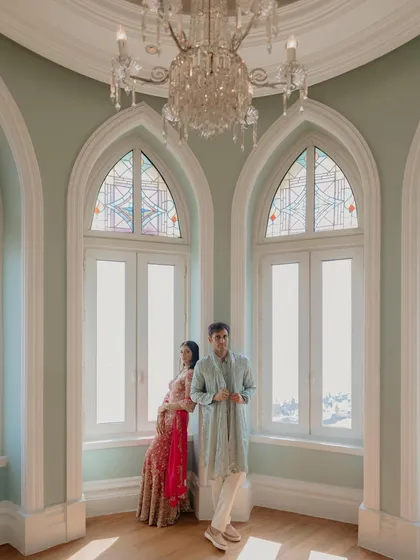 Using the beautiful arched windows and natural light at the Taj Mahal Palace to create a classic, elegant portrait. The composition feels timeless and romantic.
