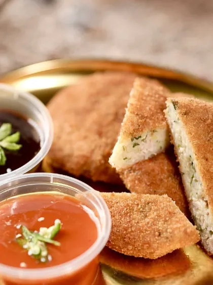 A detailed shot of the Chicken Minced Cutlet, showing the perfectly breaded exterior and the soft interior. A classic comfort food appetizer for any event.