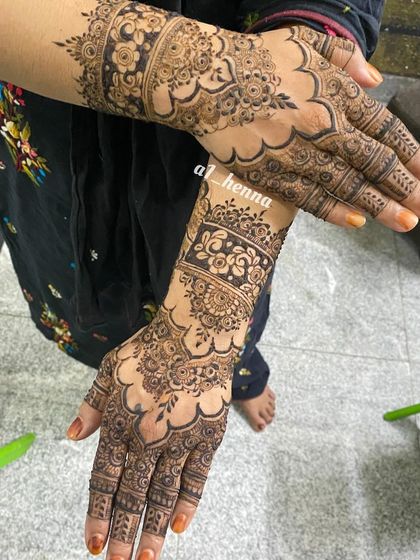 A classic party design with a floral cuff and a scalloped pattern on the back of the hand.