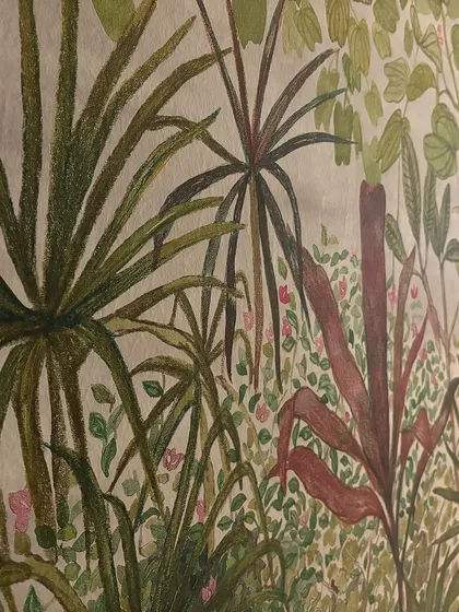 A detailed view of a lush jungle mural. The hand-painted quality of the foliage and the richness of the colors turn this wall into a captivating piece of art, foundational to the room's entire aesthetic.