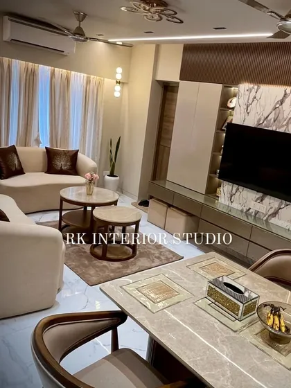 This shot captures the entire living and dining area, showing how I create a harmonious flow between the two spaces. The TV unit, sofa arrangement, and dining set are all designed to complement each other.
