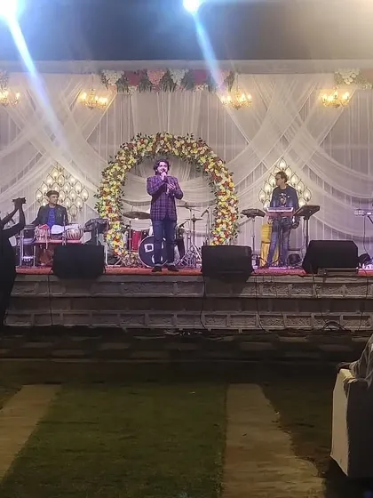The full band setup for an outdoor Sangeet in Roha. A great stage, professional sound, and a beautiful backdrop are essential for a successful show.