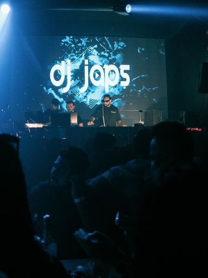 My custom logo displayed on the big screen at a club in Kolkata. I can provide similar visuals for your wedding stage to add that professional concert feel.