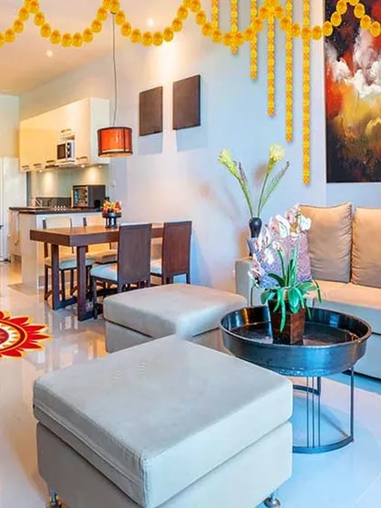 A festive home setting we designed, showing how a neutral base palette can be beautifully decorated for any occasion. The open layout connects the living, dining, and kitchen areas seamlessly.