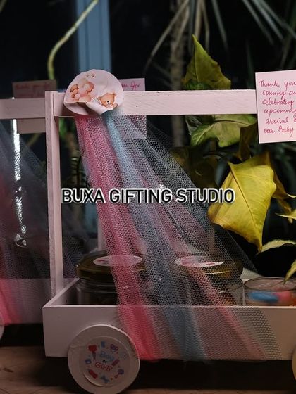 A lineup of my luxury baby shower hamper carts, ready for a celebration at Molecule Café-Restaurant Bar in Gurgaon. Each one is filled with goodies and decorated with personalized "Thank You" notes.