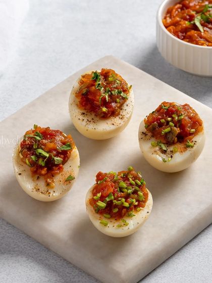 Deviled eggs with a savory stuffing, a classic party appetizer.