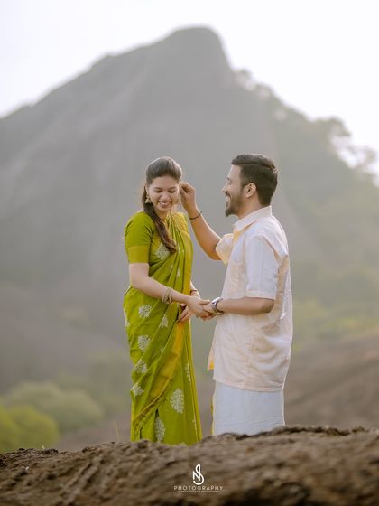 A sweet, candid moment of him gently tucking her hair. These small gestures of affection are what I love to capture.