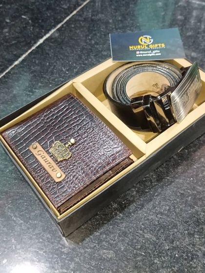 The same pure leather gift set in brown, with a crocodile wallet personalized for 'Gaurav'.