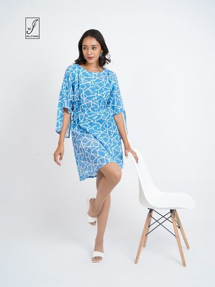 A dynamic pose that shows the movement and flow of the dress's sleeves and skirt.