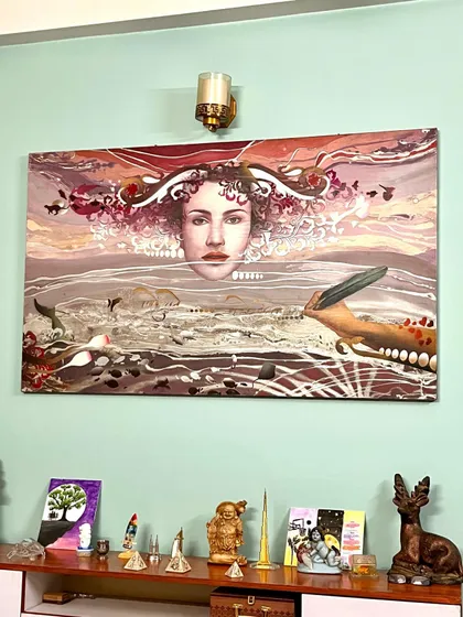 Another example of my art in a collector's home. This surrealist landscape with a central female figure brings a sense of mystery and contemplation to the space.