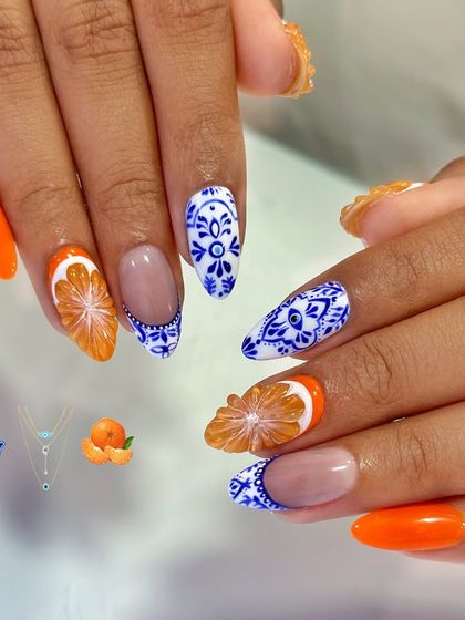 A close-up of the 3D orange slice, sculpted from acrylic to look just like the real thing. It's paired with intricate, hand-painted tile art.