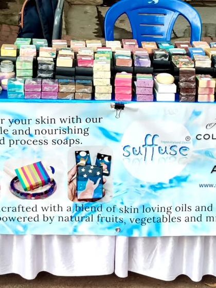 My stall is all set up at the farmer's market in Kumarapark. The table is full of colorful cold process soaps, creams, and other skincare goodies.