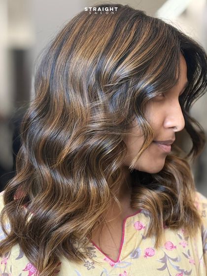 A side profile showcasing the beautiful flow of the waves and the expertly placed highlights.