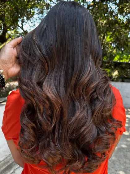 A simple highlight refresh can make a world of difference. I brightened up her existing color and gave her a fresh style, making her hair look vibrant and healthy again.