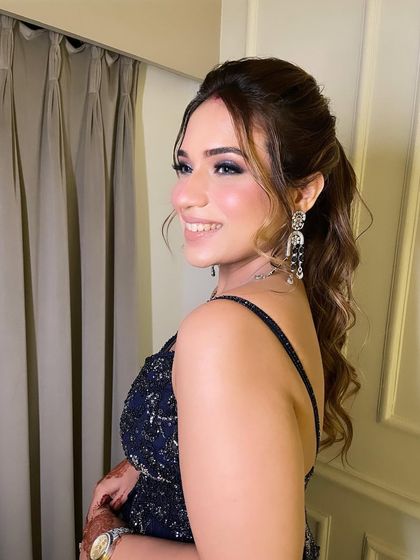 I love a pop of color. These frosty blue eyes were the centerpiece of this stunning cocktail look, paired with glowing skin and a simple lip to keep the focus on her eyes.