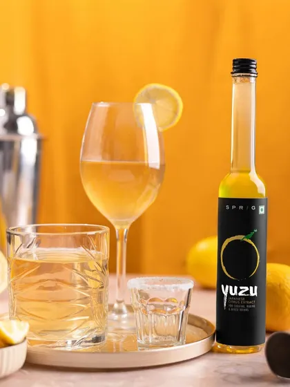 Here, the Yuzu extract is styled as the star of a home bar setup. This positions the product as a key ingredient for creating sophisticated cocktails, appealing to customers interested in mixology.