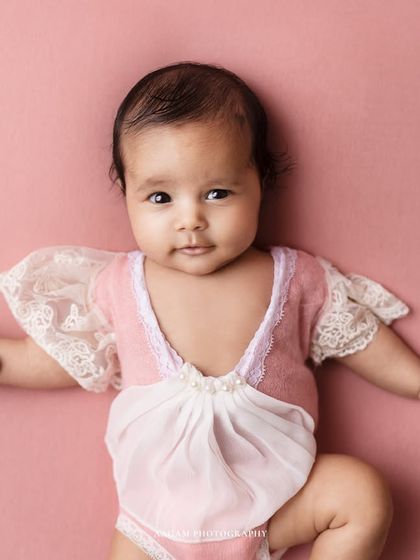 A different pose from the same session, showing her little personality starting to shine through.