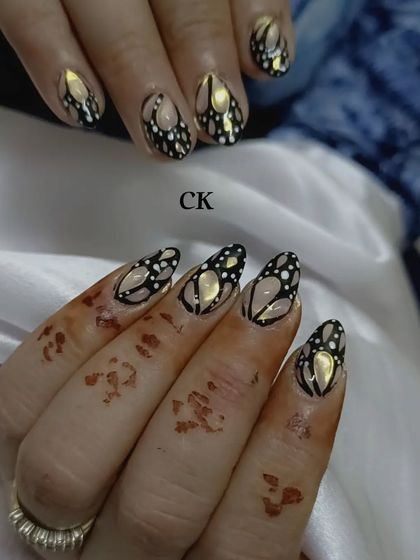 A dramatic black and gold butterfly wing design.