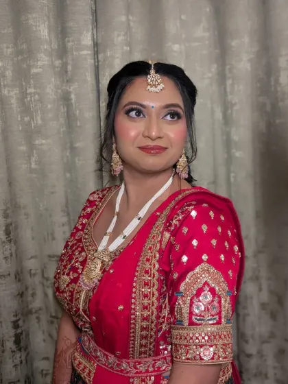 A poised and elegant bridal portrait. The makeup is meticulously applied to ensure it looks flawless from every angle and lasts throughout the long wedding day.