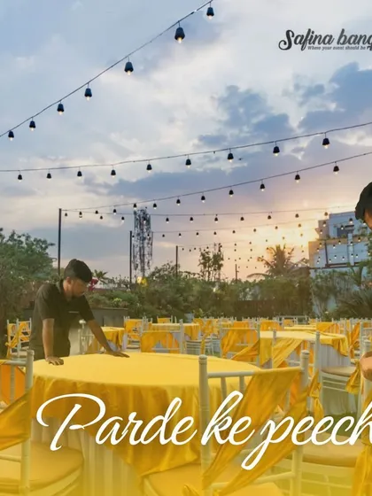 Another "Parde ke peeche" shot, showing our team setting up the dining tables for an outdoor event at dusk.
