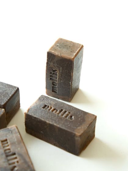 The rich, dark color of the coffee-infused 'Milano Morning' soap.