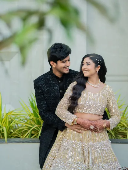 A joyful and intimate portrait of Apoorv and Shikha. His embrace from behind and their shared smiles make for a heartwarming photograph.