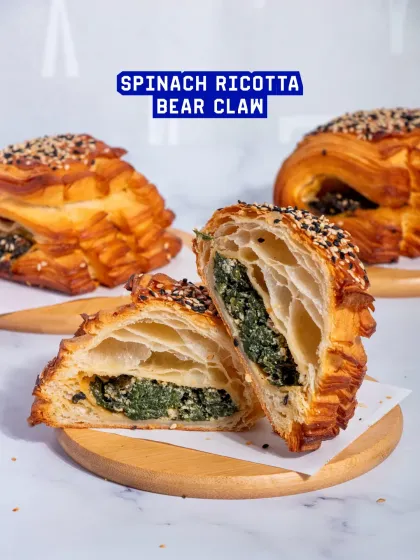 My Spinach Ricotta Bear Claw is a classic savoury pastry. The flaky croissant dough is filled with a creamy mixture of spinach and ricotta, then topped with sesame seeds.