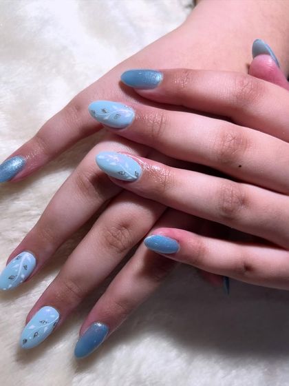 Feeling blue in the best way possible. This lovely design features a soft blue base with delicate, hand-painted silver leaf patterns.