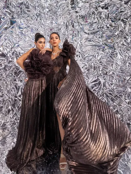The flow and structure of these metallic gowns from Kalki Fashion are on full display here. I love working with textures that create movement and visual interest.