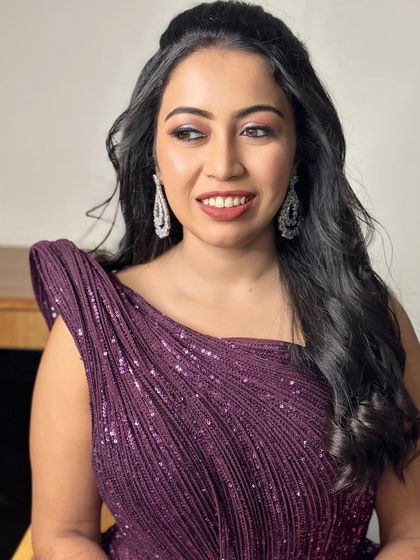 A side profile showcasing the soft hairstyle and the glowing, flawless skin.