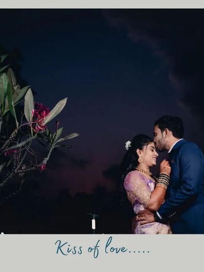 "Kiss of love." A romantic silhouette of the groom kissing the bride's forehead against a twilight sky. This is the kind of cinematic moment we love to create.