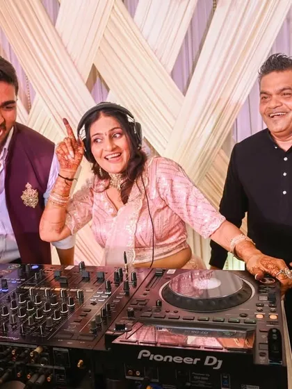 The best part of my job is seeing the pure joy on people's faces. Here, I've invited the happy couple and their family to take over the decks for a song.