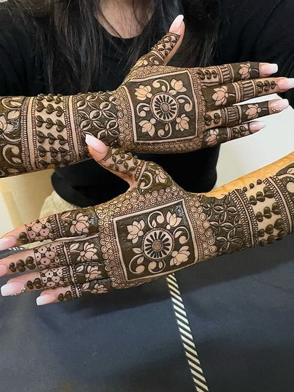 A unique design with large square panels on the back of the hands, filled with intricate floral mandalas.