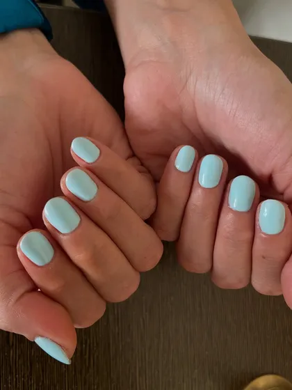 A full view of the beautiful solid light blue nails, showing how a simple color can make a big impact.