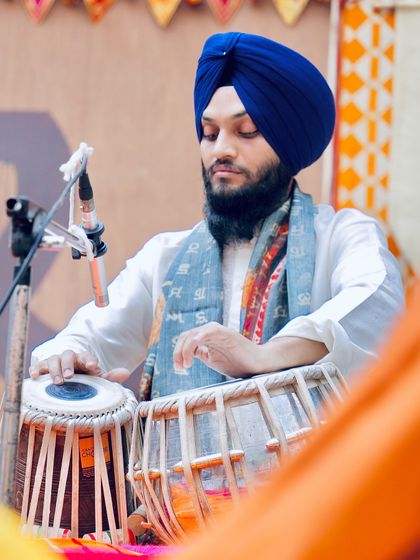 A side view of my performance in Delhi, with the traditional Indian textiles creating a vibrant setting.