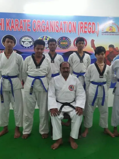 Our instructor with a group of blue belt students. We foster a close-knit community where instructors know their students and guide their individual progress.