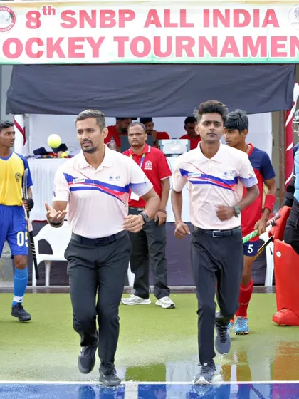 We don't just build players; we build leaders in the sport. Here, one of our cadets, Shyam Sharma, proudly takes the field as an official at the prestigious SNBP All India Hockey Tournament, showcasing the diverse opportunities our program offers.