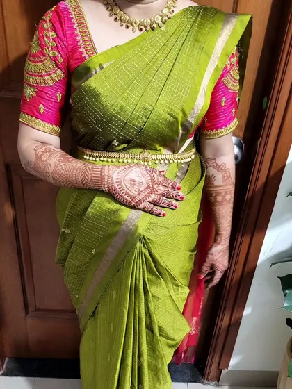 Saree draping for new mom Sowmya. The drape is styled to be comfortable and easy to manage, perfect for post-pregnancy events or ceremonies.