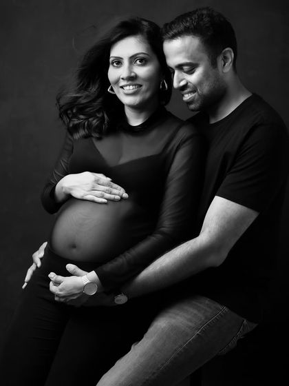 The shared joy and connection in this pose is the complete focus of the image in black and white.