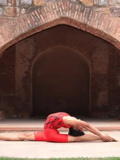 A full split with a deep backbend, framed by the beautiful architecture of this historic site. A calm mind leads to a strong, flexible body.