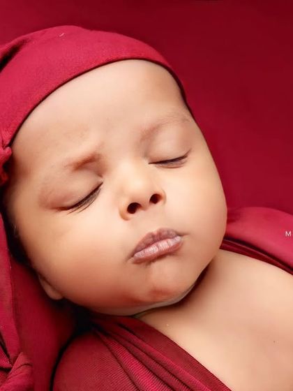 A cute pouty face just before drifting back to sleep. Every expression is worth capturing.