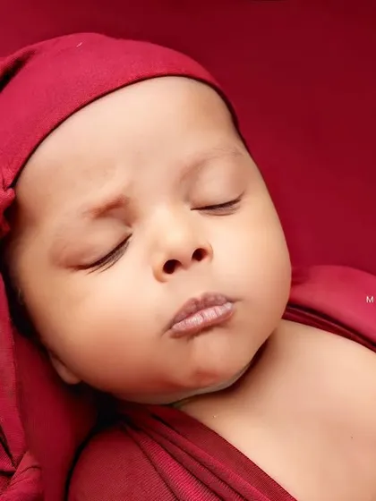 A cute pouty face just before drifting back to sleep. Every expression is worth capturing.