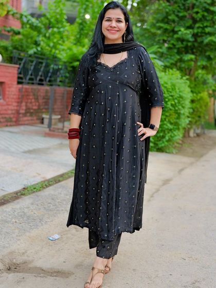 This black suit was created from fabric for our anniversary photoshoot. The simple Anarkali silhouette with a sweetheart neckline is a timeless choice.