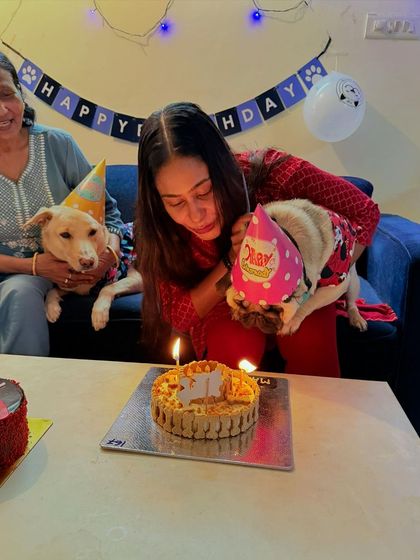 Making a wish! The whole family gathers to celebrate Max's 2nd birthday and blow out the candles on his cake.