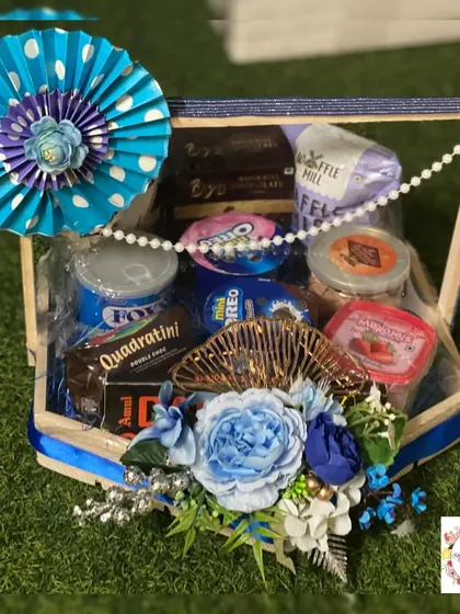 A snacks hamper designed as part of a wedding trousseau. These are great for placing in the rooms of out-of-town guests as a welcome gift.